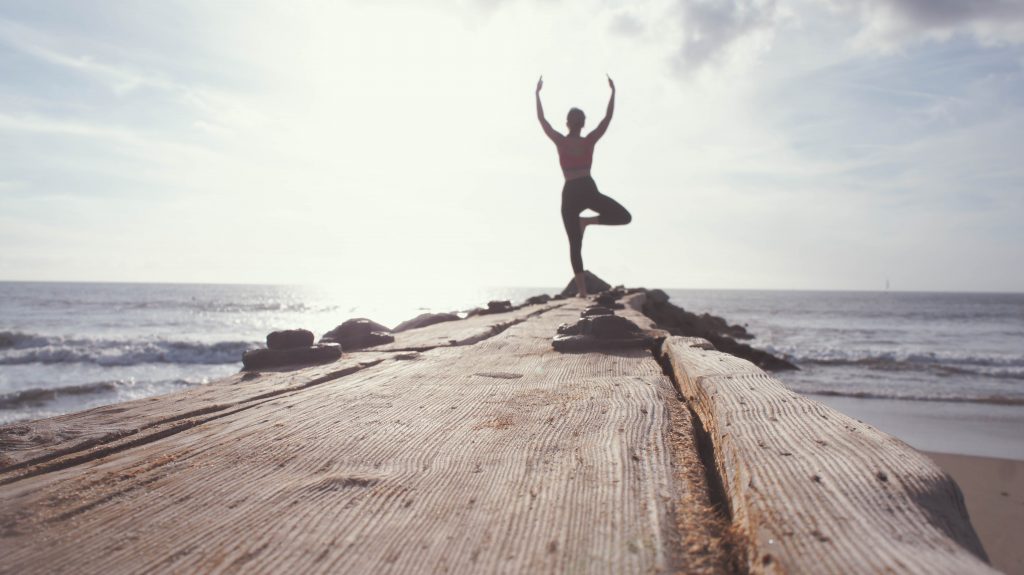 women doing Yoga in the sun rise